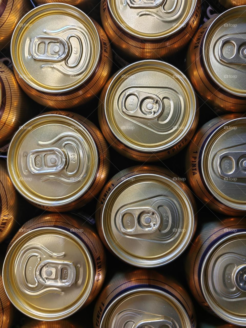 Bottles of beer stand in a row