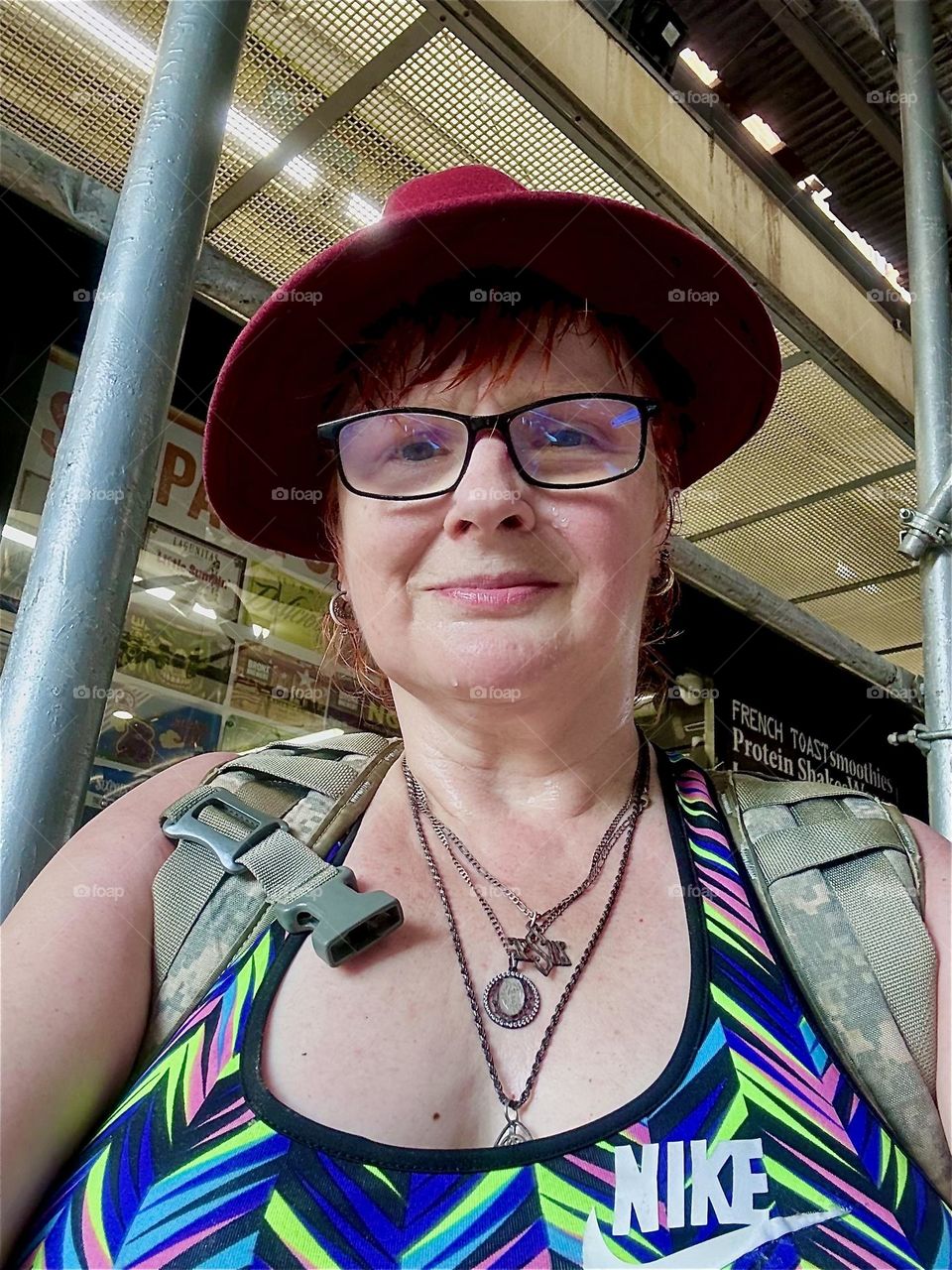 This is me, “Petra Schiller” a.k.a. “Maxine Firefox” a.k.a. “Maximiliane Feuerfuchs” standing in the busy area underneath the “M” train overpass at the “Myrtle Ave” station and “Broadway” in “Bushwick”, Brooklyn. 2024. Hypnotic Productions