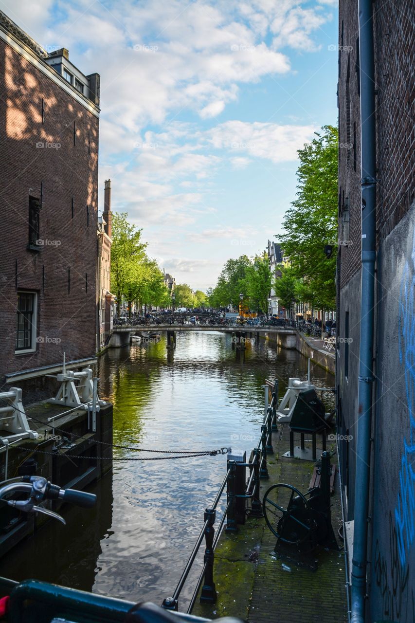 Overlooking the canal in Amsterdam in between the houses