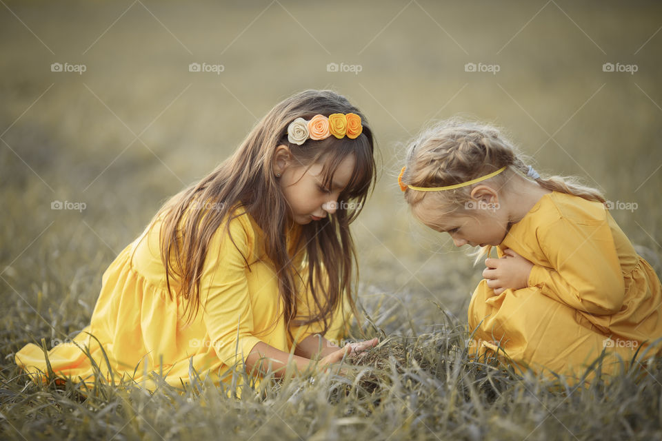 Little girl in yellow dress outdoor portrait 