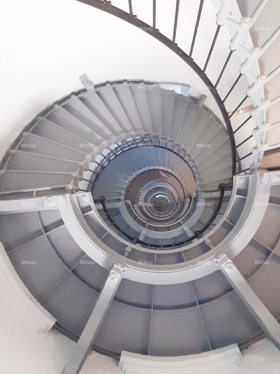 A view of the spiral staircase at Ponce Inlet Lighthouse from the ground up. it is a very steep staircase and a good workout.