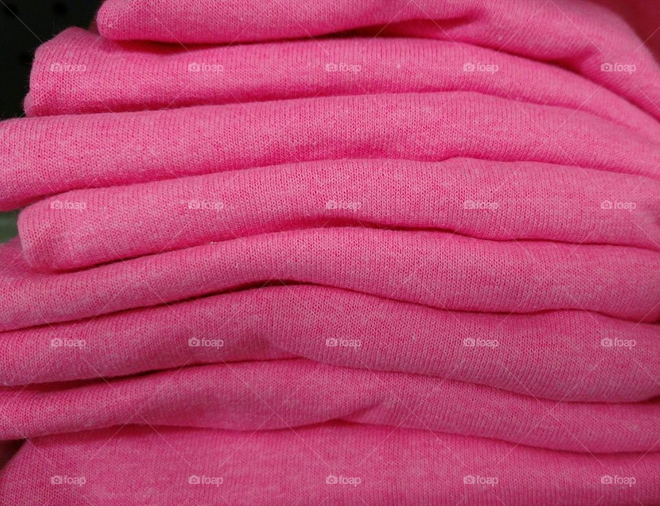 Stack of soft pink textiles