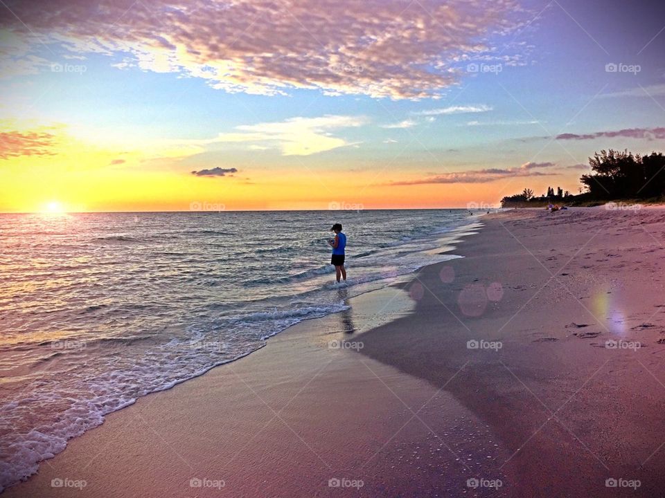 Alone on the beach at sunset. Alone on the beach at sunset