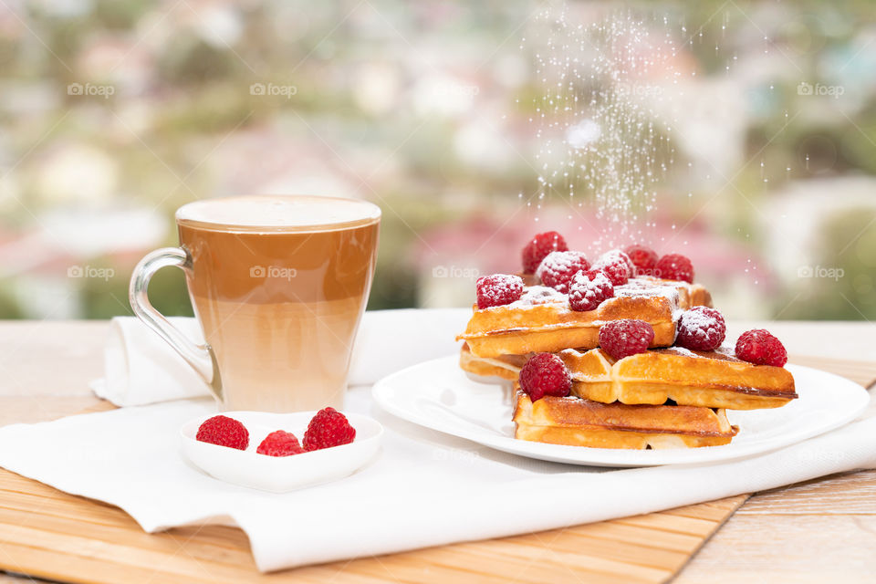 coffee with milk and Belgian waffles for breakfast