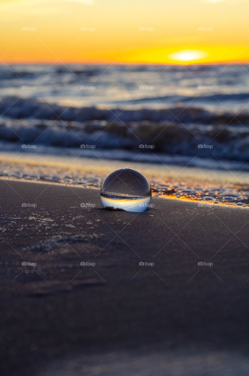 Beautiful and georges Baltic sea sunset through the lensball