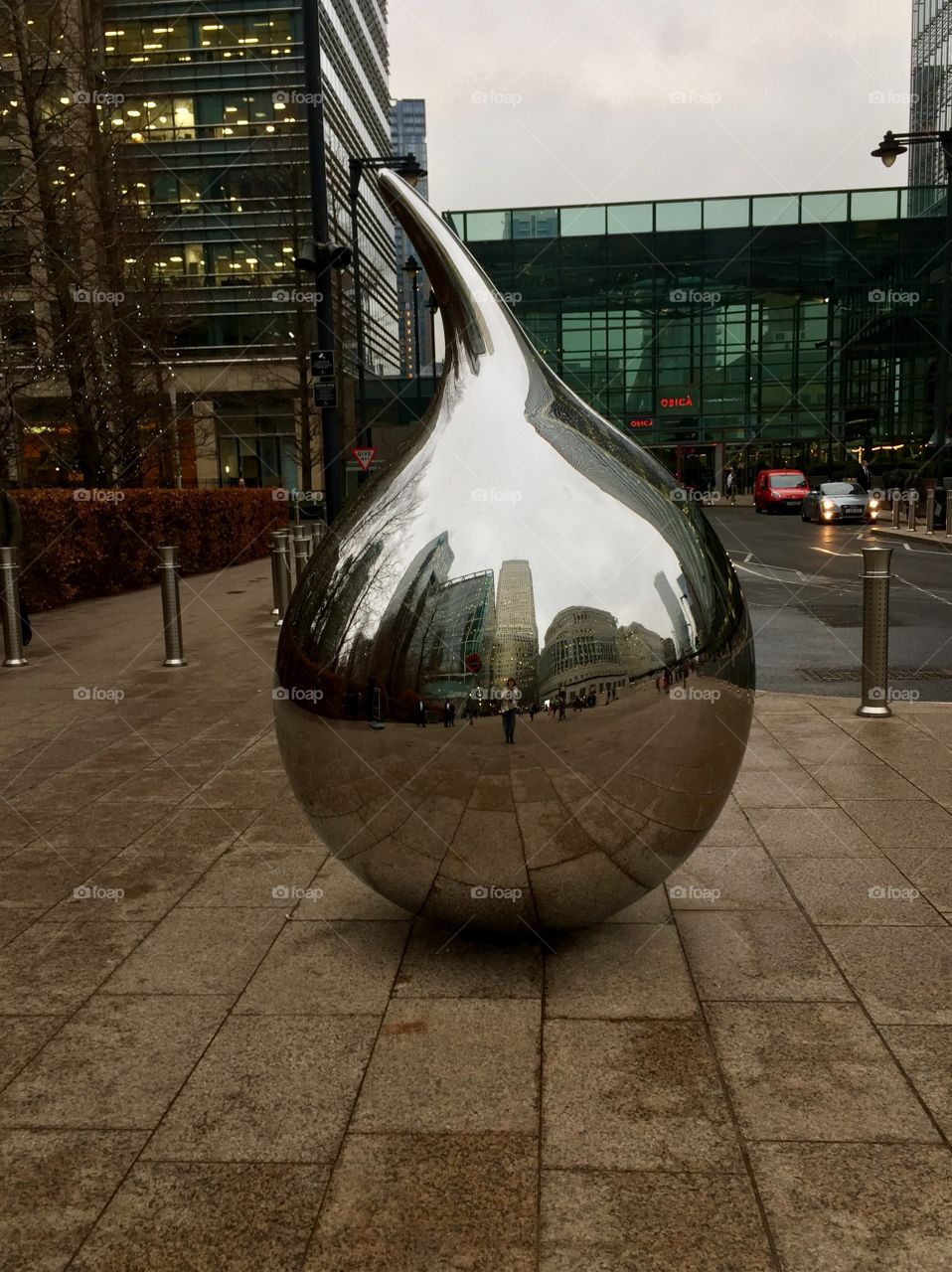 London, Canary Wharf. Reflections of buildings in mirror art installations 