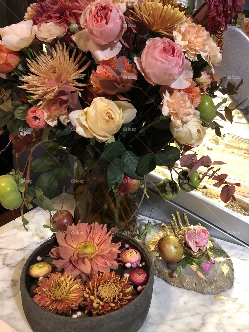 An elaborate and beautiful mostly blush colored bouquet with its own ornamental bouquets underneath. 