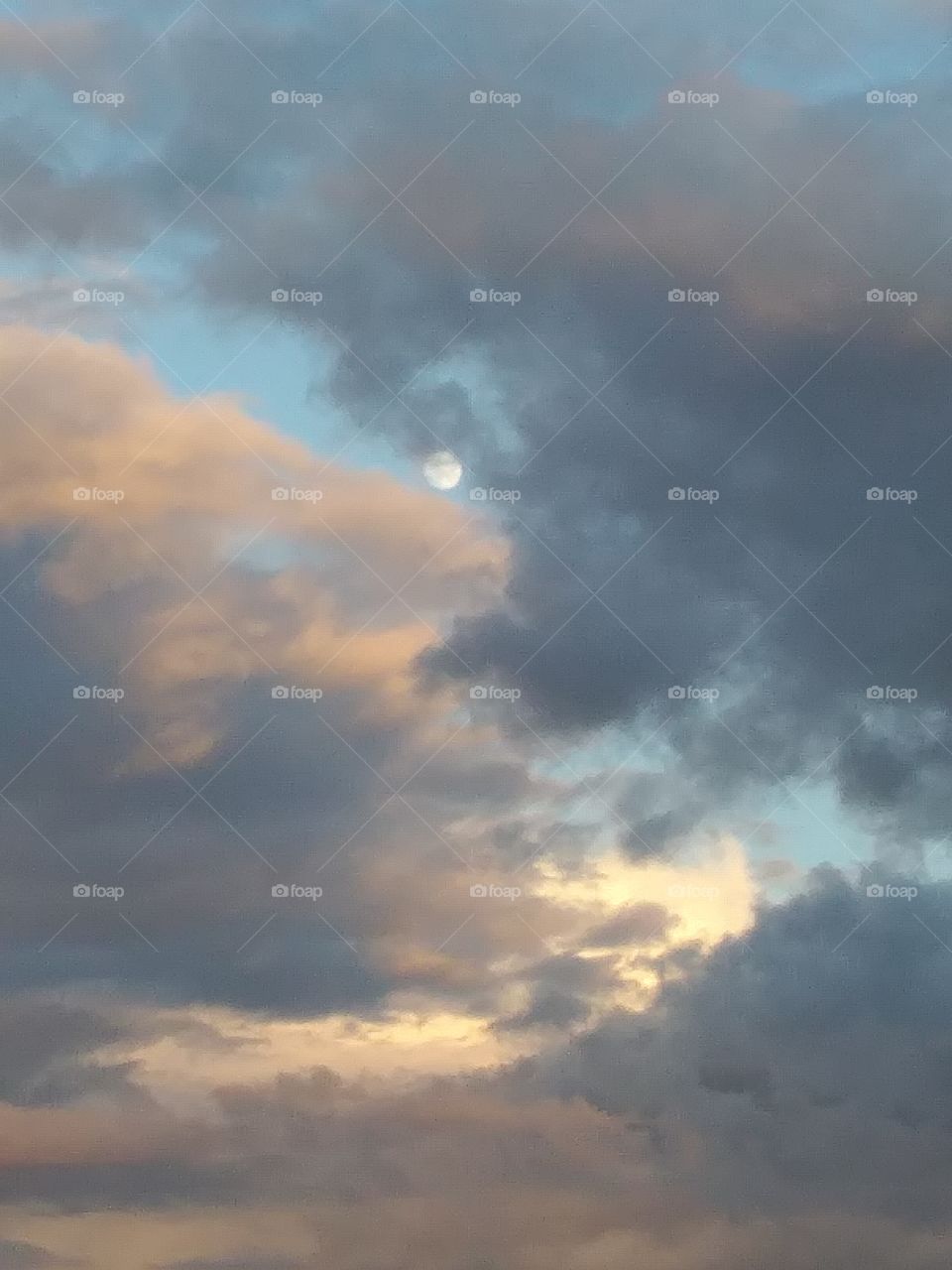 Moon breaking from clouds
