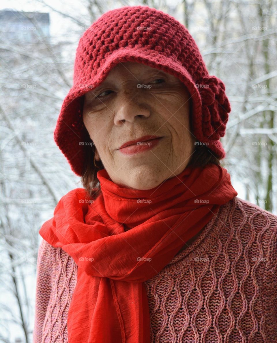 woman in red hat winter background