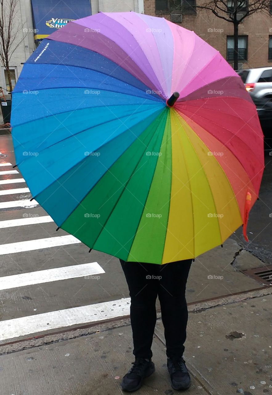 Person holding colorful umbrella