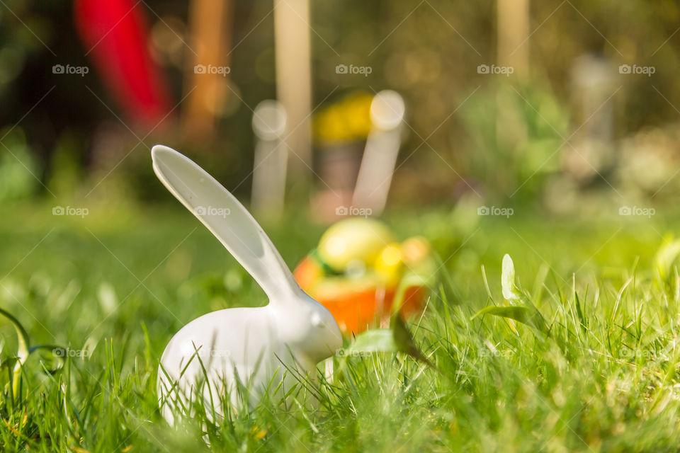 Easter decoration in garden  . Easter decoration with busy and eggs on grass in garden. 