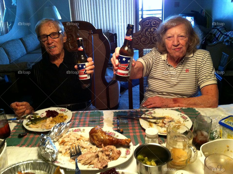 Elderly Couple Celebrating With a Drink