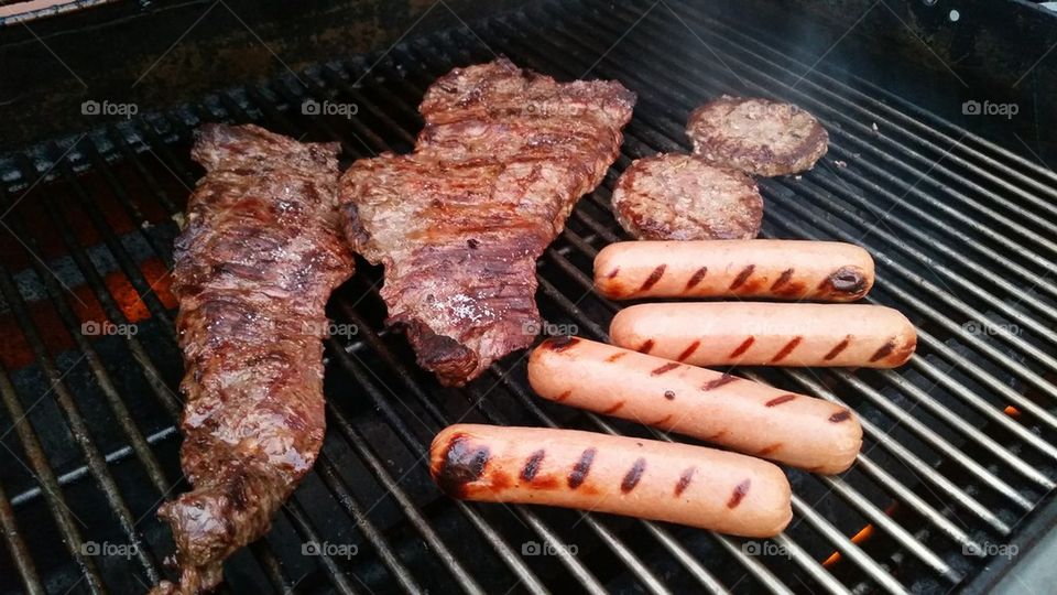 grilling steak, hamburger and hot dogs