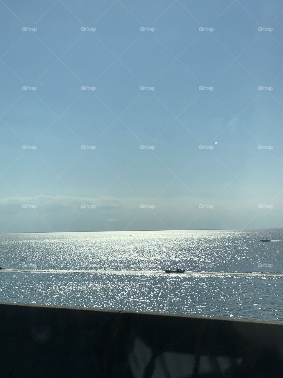 The Ponchatoula River shimmering with sunlight on it and blue sky delighting the eye.