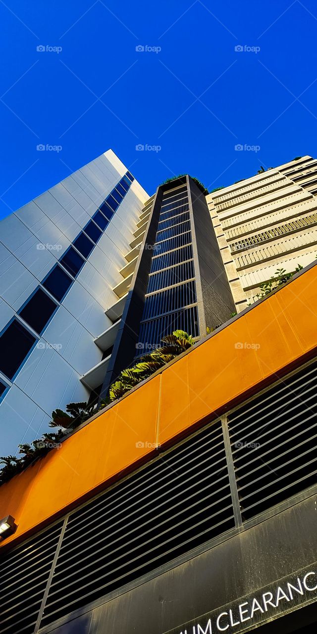 Up angle photo of a tall apartment building