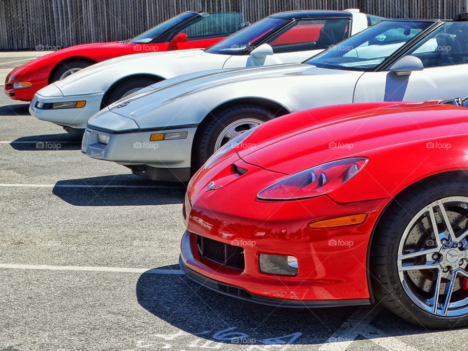 Collection Of Chevy Corvettes. Display Of Chevrolet Corvettes From Different Model Years
