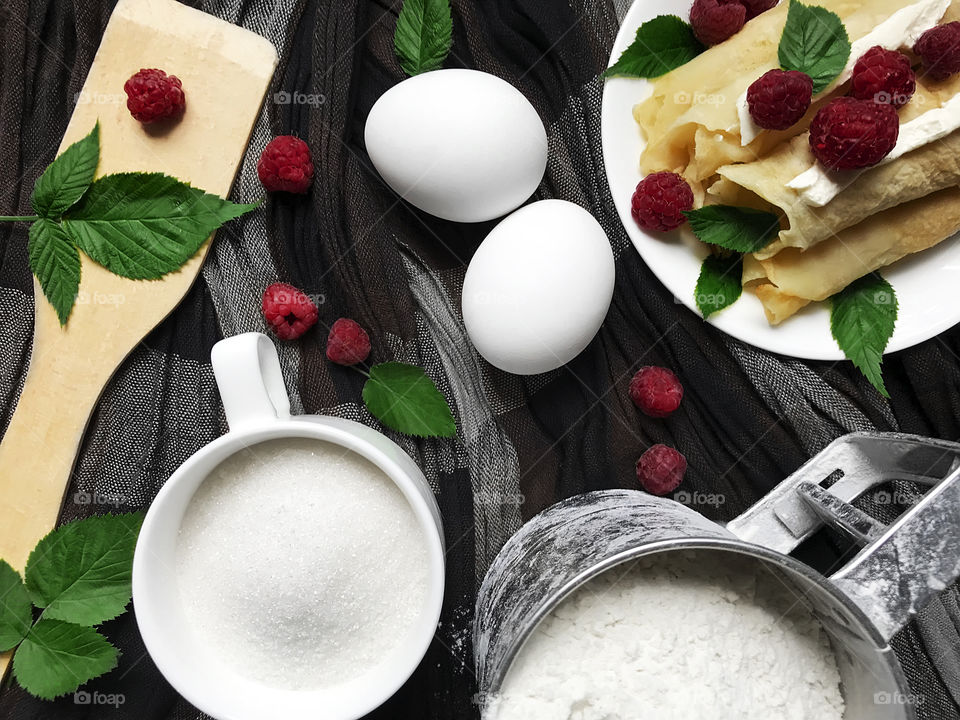 Ingredients for pancakes with raspberries 