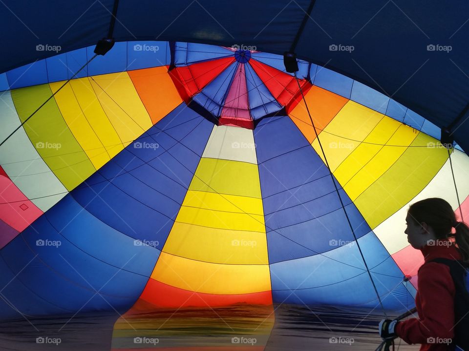 Inside hot air balloon inflation, rainbow of colors
