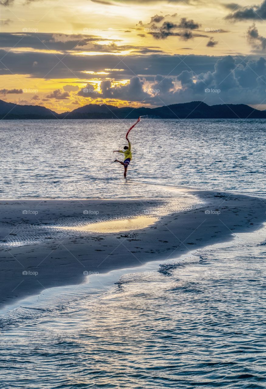 Dance on the beautiful summer beach in Thailand