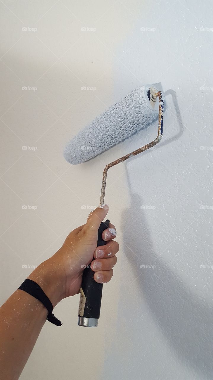 using a paint roller