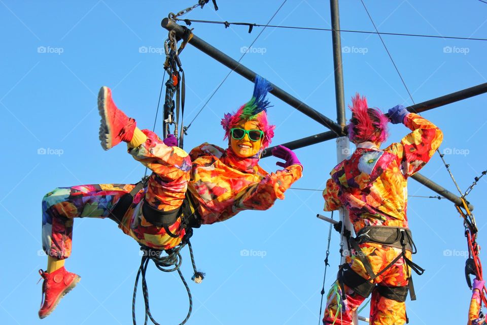 aerial acrobat woman in autumn color costume