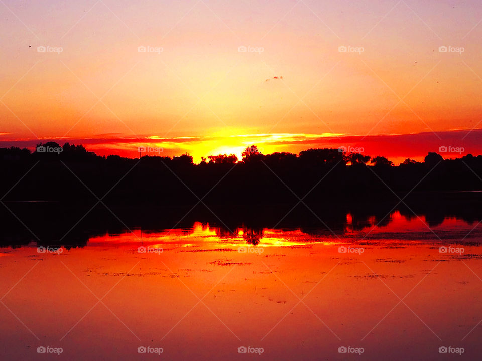 Orange sunset over the lake 