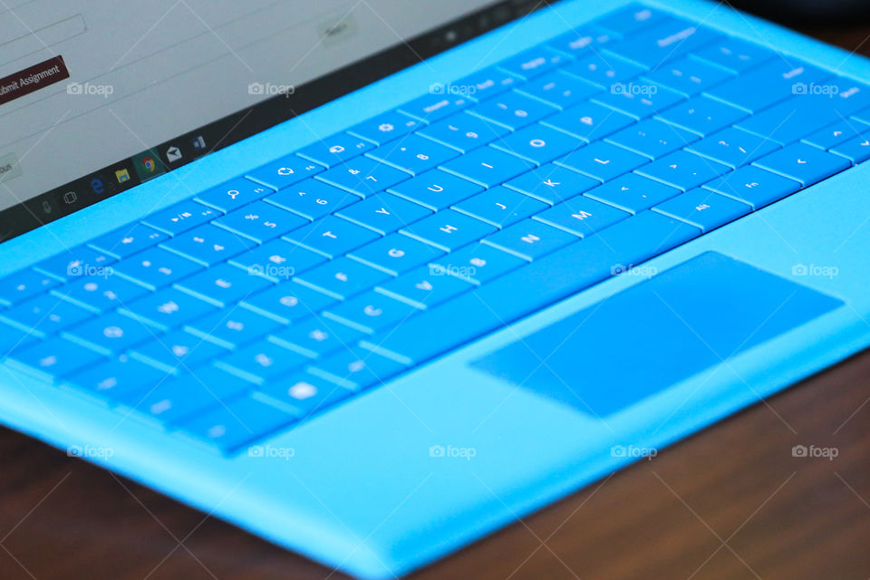 Isolated blue keyboard on a portable computer