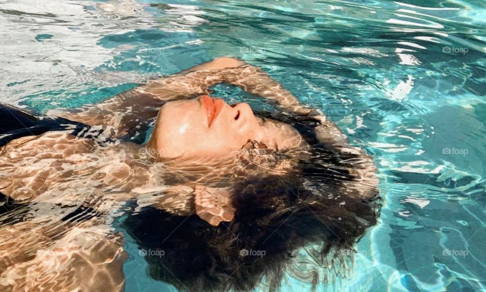 Girl swimming in the pool