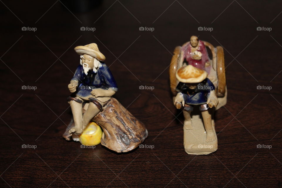 Decorations with figurines. Asian workers 