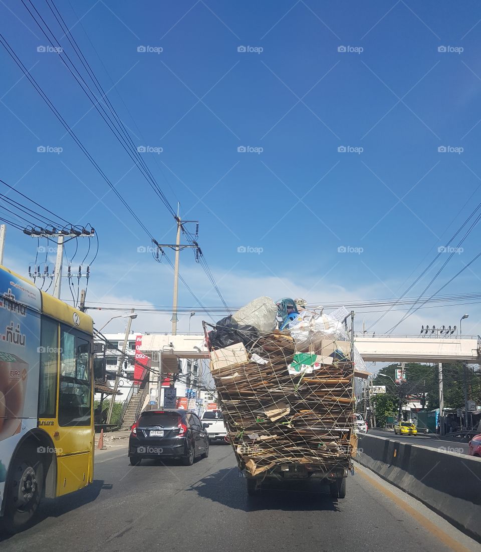 dangerous overloaded pickup truck on the road