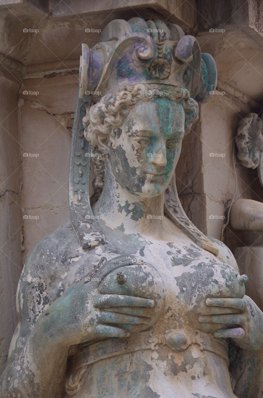 Detail with a lactating nereid, Fountain of Neptune, Bologna