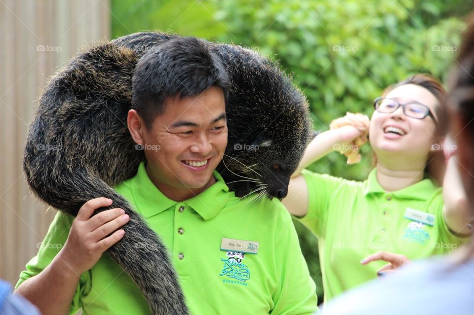 Zookeepers introduce an Animal