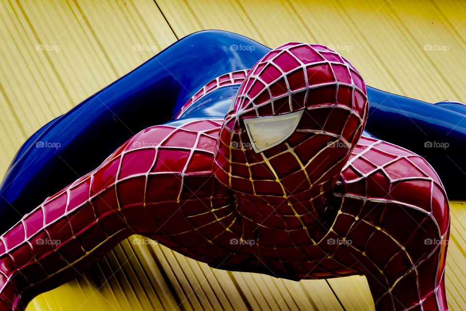spiderman on yellow wall 