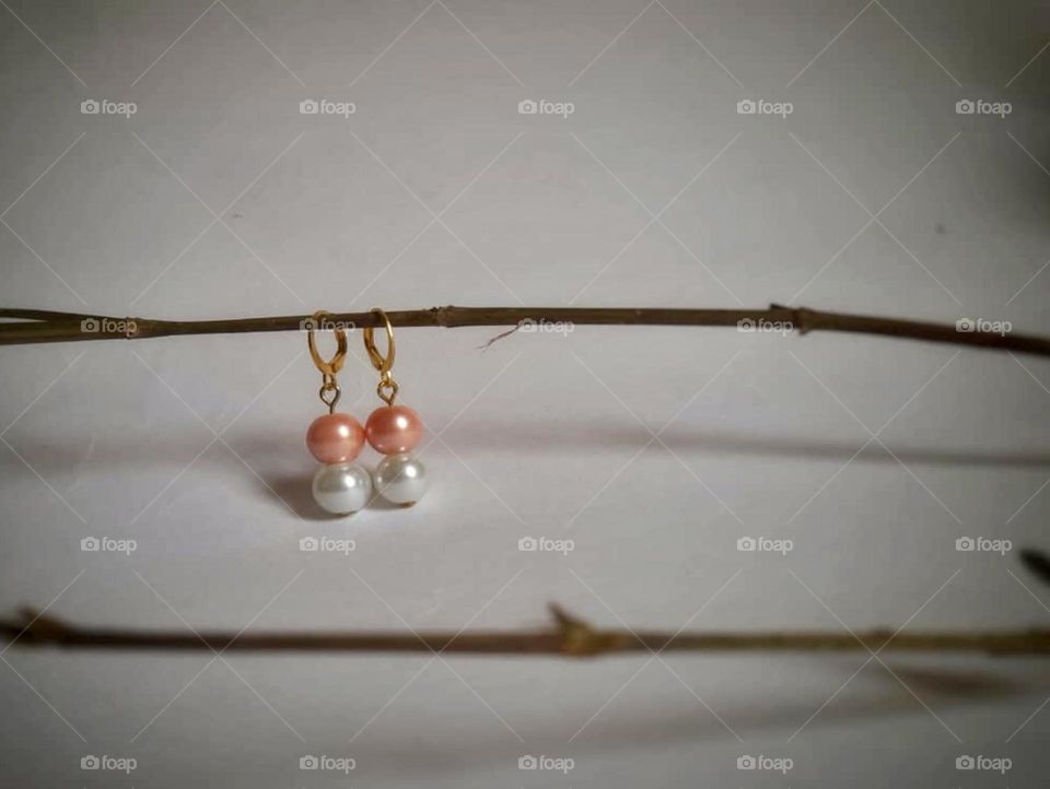 Earrings on stick.