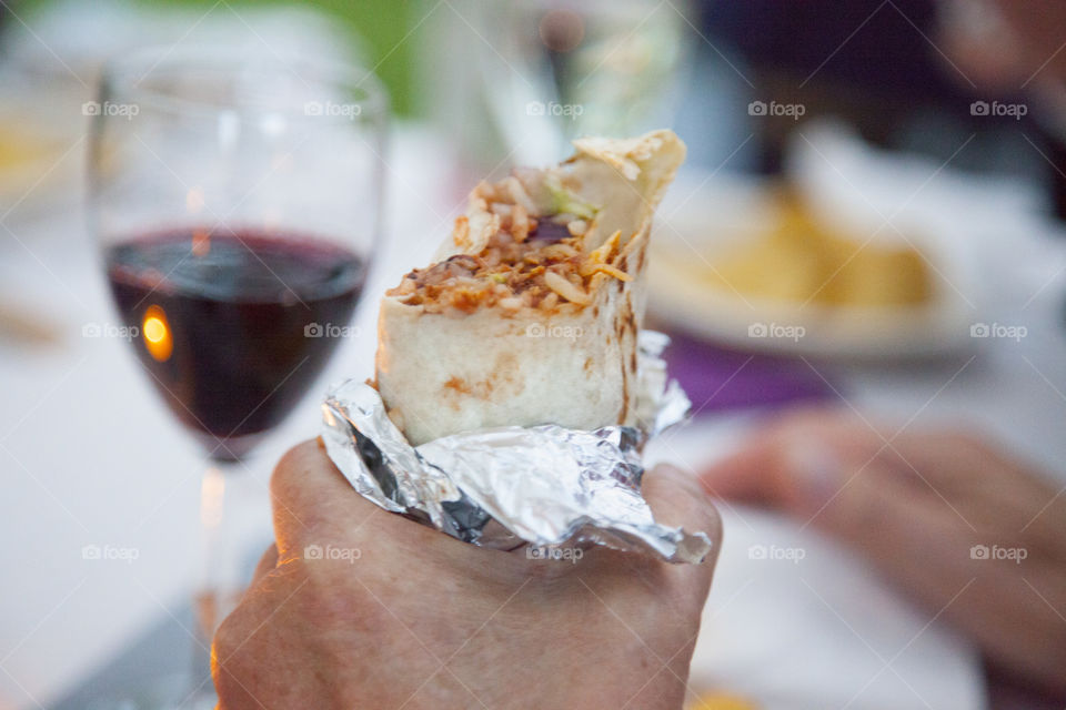 Hand holding rolled snack