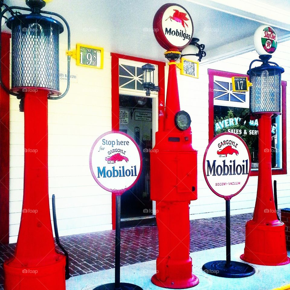 three red gas pumps 