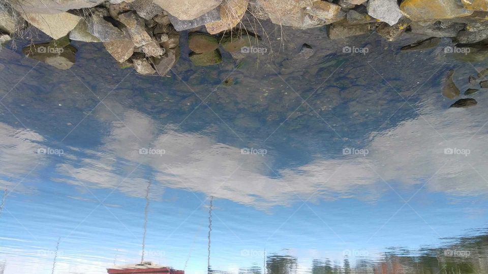 Reflection of the sky on a serene pond in Clarence, Hobart.