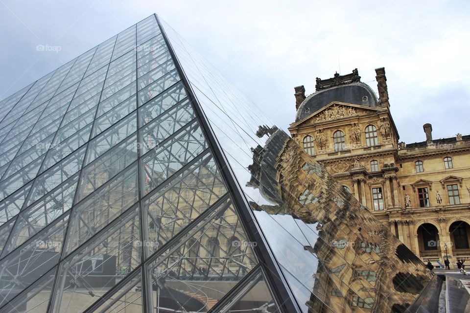 The Louvre building.Piramid in Paris 