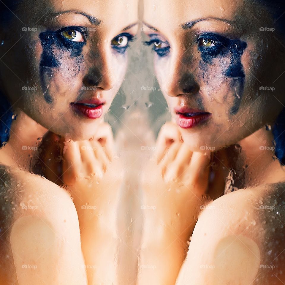 Sad woman with messy mascara