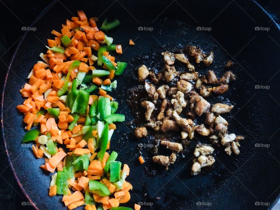 Vegetable and chicken fried for chicken fried rice in a pan