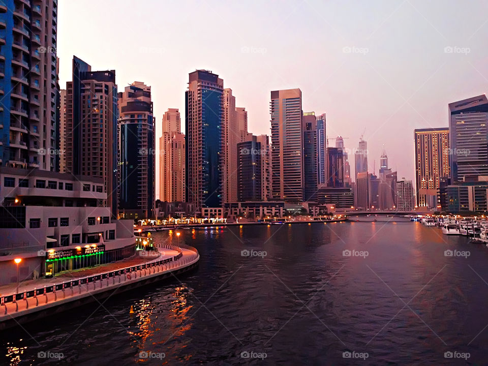 Beautiful evening in Dubai Marina above the local architecture 