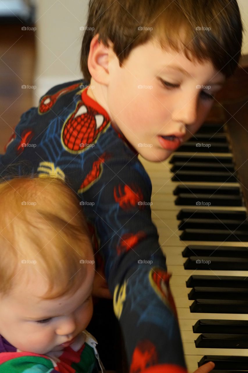 Young Children Playing Piano
