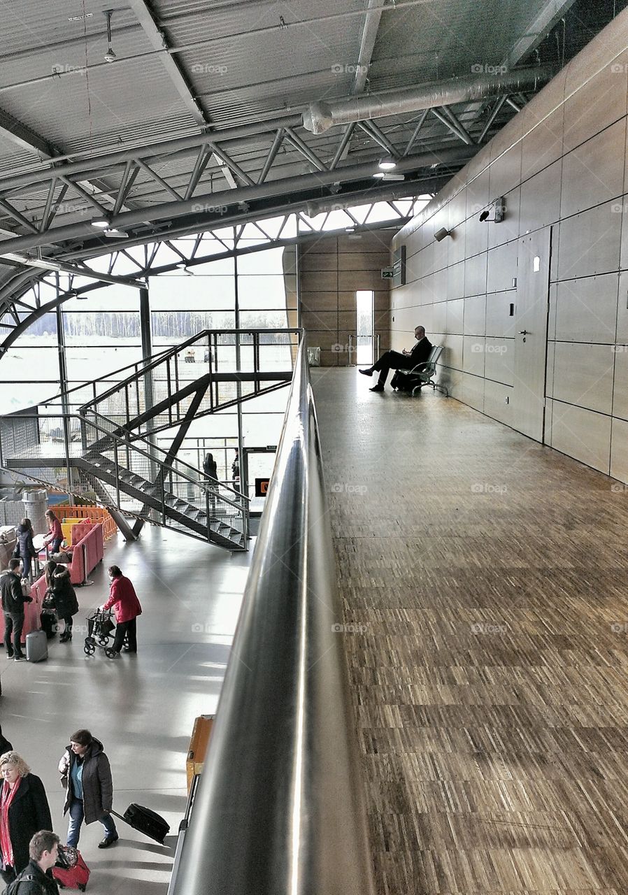 Man waiting for his flight at airport