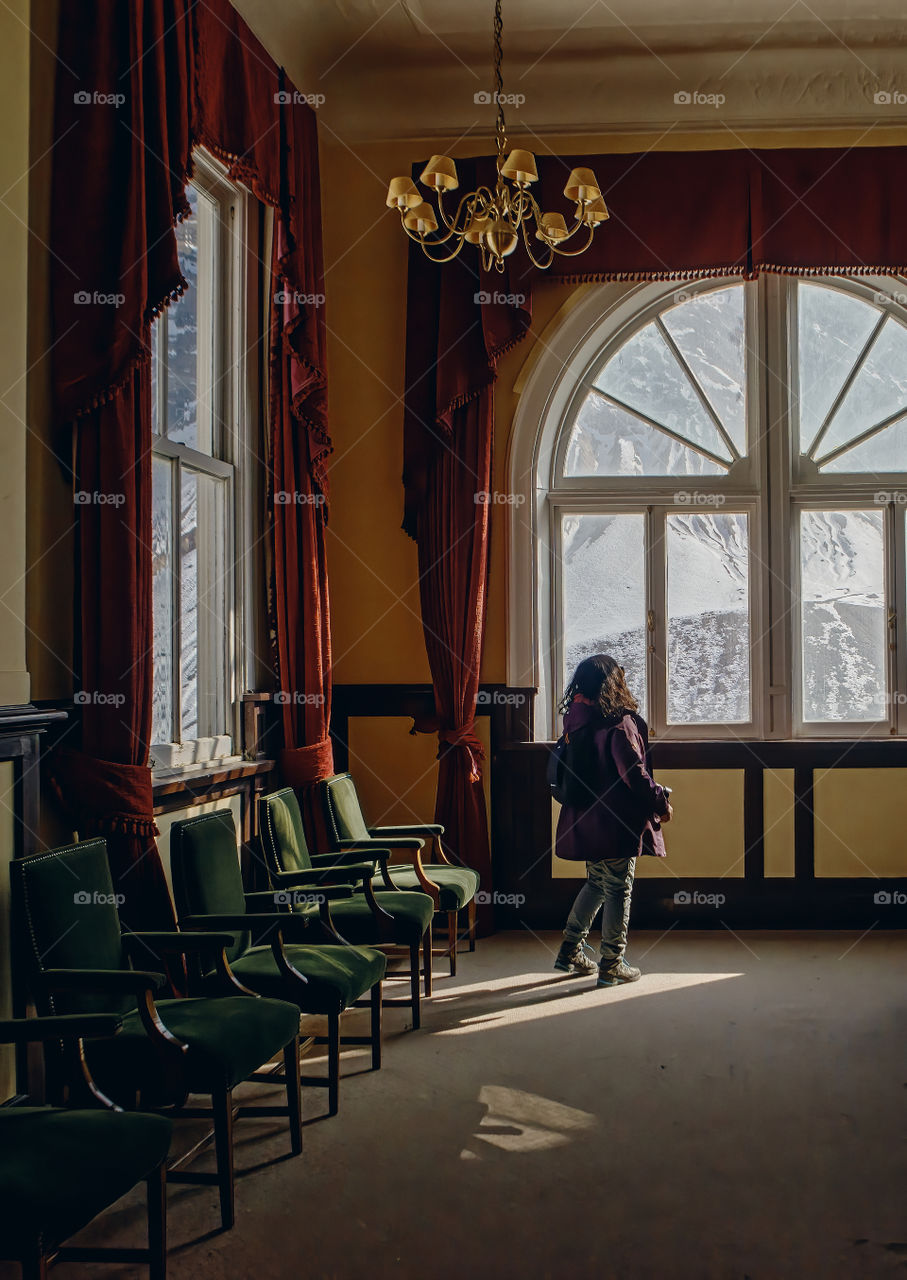 Woman looking through the window