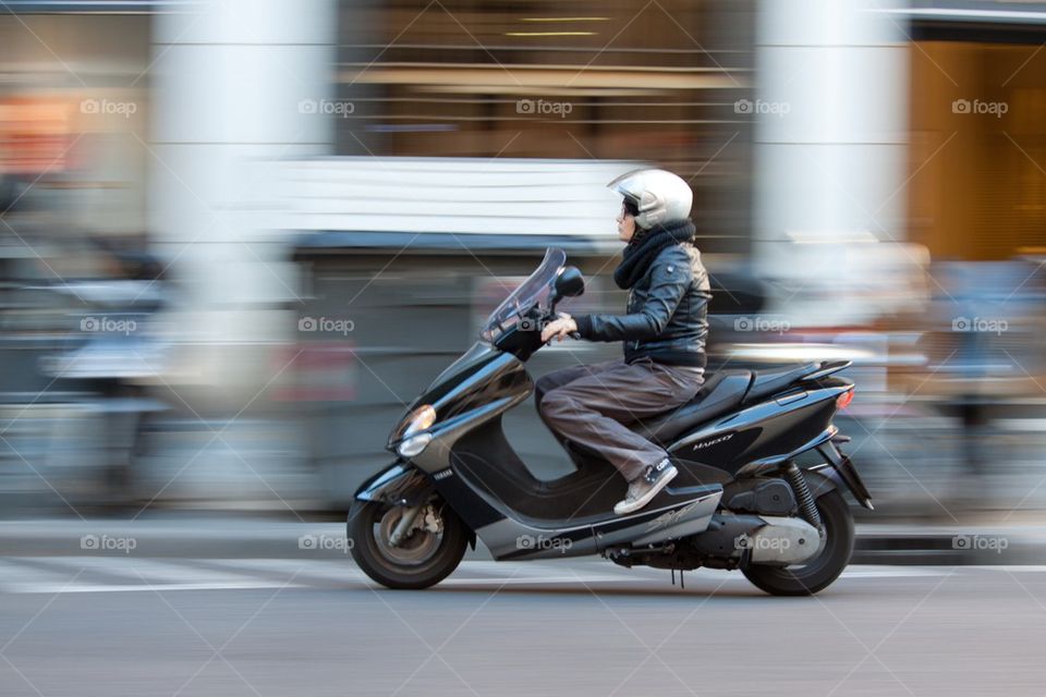 Woman on scooter.