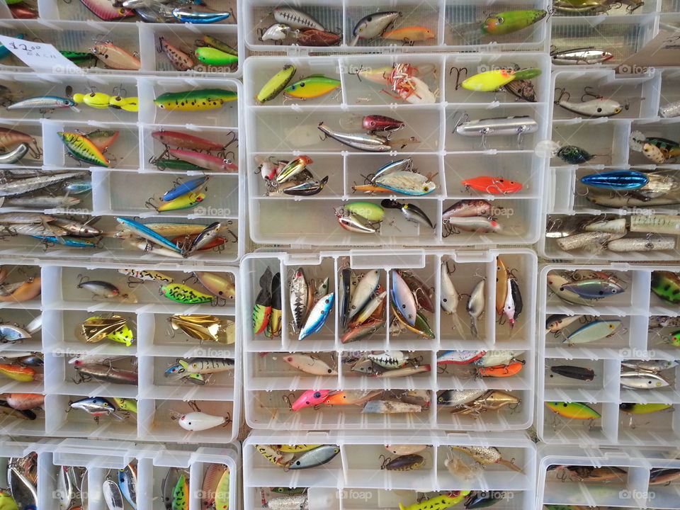 fishing lures. tackle boxes of a variety of colorful fishing lures