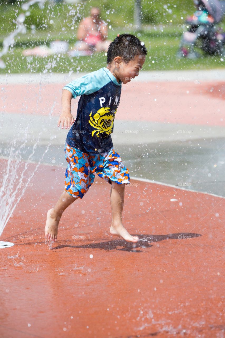 Boy playing water 
