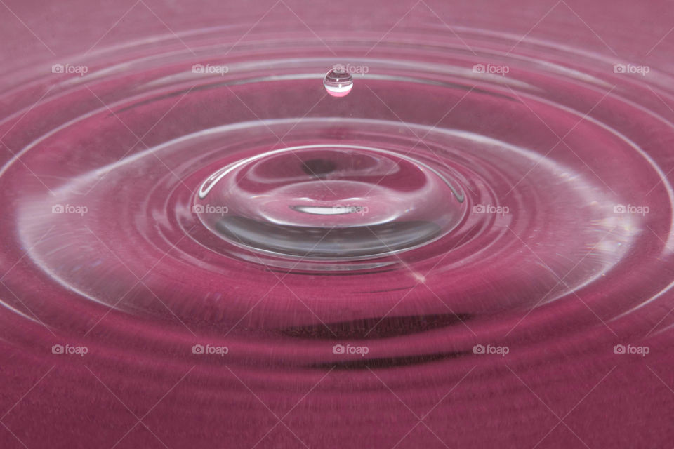 Water drop on a red background