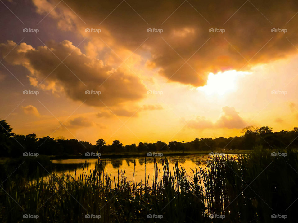 Big Cloud Formation Over A Sunset Sky At A Pond In A New Jersey Park