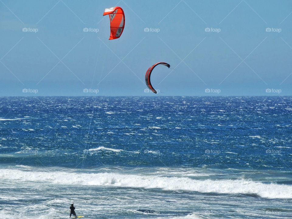 Wind Surfing In California. California Surfers Use Colorful Sails To Catch The Waves